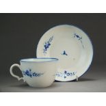 A Caughley tea cup and saucer painted with the Chantilly Sprig B pattern, circa 1786-94, S mark,