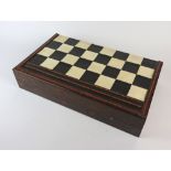 A 19th century rosewood, ivory and ebony satinwood banded folding games box,