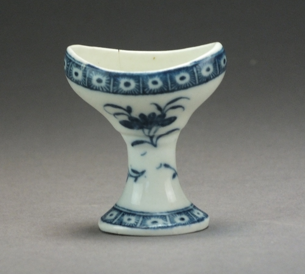 A Caughley eye bath, transfer-printed in underglaze blue with a Sprig and Cell Border,