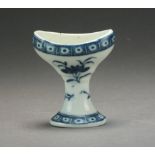 A Caughley eye bath, transfer-printed in underglaze blue with a Sprig and Cell Border,
