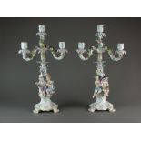 A pair of Meissen figural four-branch candelabra modelled by E.A.