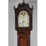 A Victorian oak crossbanded mahogany eight day longcase clock the 14 inch arch enamel dial signed