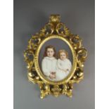 A KPM Berlin porcelain oval plaque painted with two young girls in white dresses with multicoloured