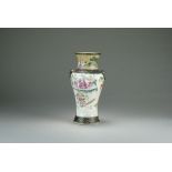 A Chinese famille rose vase, late Qing Dynasty, of baluster form with mask handles,