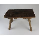 A 19th century primitive four leg stool,