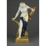 A Royal Worcester figure of 'The Bather Surprised', gilded and with deep blue drapery, shape 486,