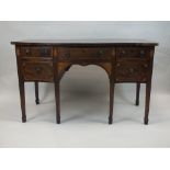 A George III crossbanded mahogany serpentine front sideboard late 18th/ early 19th century,