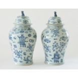 A large pair of Chinese blue and white vases and covers, 20th Century, of baluster form,