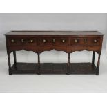 A George III oak Montgomery three drawer dresser base,