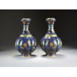 A pair of Chinese cloisonne vases, late Qing Dynasty, of lobed ovoid form with garlic necks,