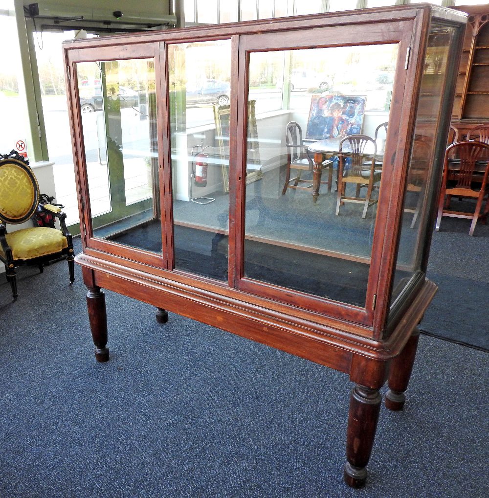 A late Victorian mahogany floor standing retailers display cabinet,