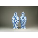 Two Chinese blue and white vases and covers, 19th Century,