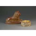 A Derbyshire salt glazed stoneware flatback model of a recumbent lion, circa 1830-50, 11.