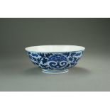 A Chinese blue and white bowl, Qing Dynasty, of plain rounded form raised on a straight foot ring,