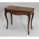 An early 20th century Louis XV style figured walnut serpentine fold-over card table,