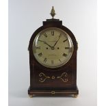 A Regency mahogany brass inlaid boxwood strung lancet bracket clock,