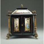 A late 19th century Vienna enamel and ebonised miniature table cabinet, with bronze mounts,