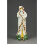 A prattware figure emblematic of 'Winter', circa 1800,