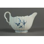 A Caughley cream jug painted with sprigs, circa 1775-77,the body with fine basket moulding,