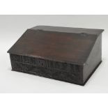 A William and Mary boarded oak sloping table top desk,