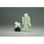 A Chinese celadon jade figure of Guanyin, late Qing/Republic period, modelled standing, 12cm high,