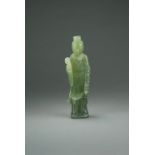 A Chinese celadon green jade figure of Guanyin, late Qing/Republic period,