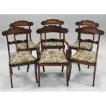 A set of six William IV mahogany bar back and saber leg dining chairs including one carver (1+5)