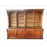 A Victorian oak Gothic revival country house library bookcase,