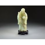 A Chinese jade figure of Shou Lao, late Qing/early Republic,