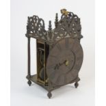 A twin fusee brass lantern style mantel clock, the 6.