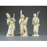 Three Japanese sectional ivory figures, Meiji period, a guard with spear and horn,