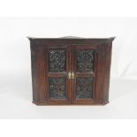 A 19th century oak wall hanging straight front corner cabinet,