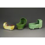 Two late 18th century green glazed child's cradles, 13cm and 13.