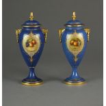 A pair of Royal Worcester vases and covers painted with central panels of fruit by E.