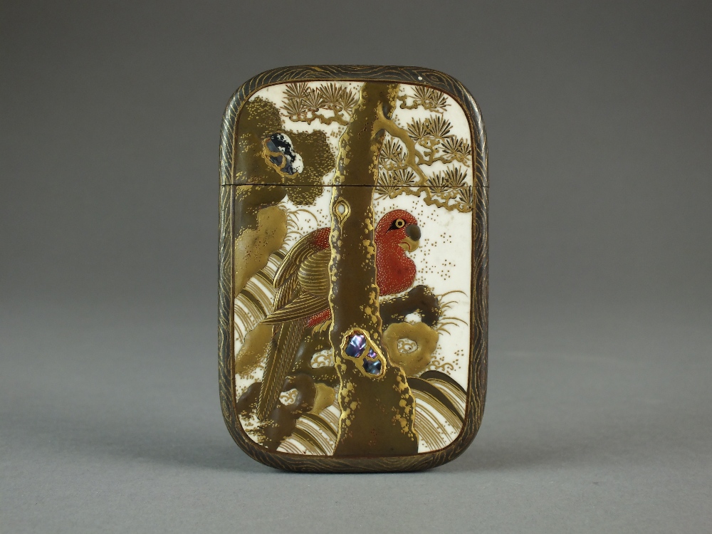 A Japanese lacquered ivory card case, Meiji period, of rectangular form with rounded corners,
