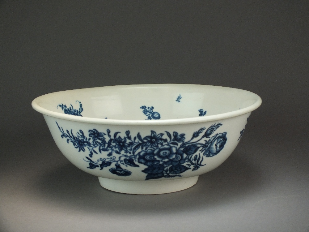 A Caughley wash stand bowl transfer-printed with the Pine Cone, Three Flowers and Fat Pear pattern,