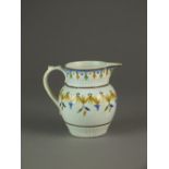 An early 19th century prattware jug painted with simple ochre, green and blue banding, 12.