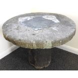 A large staddle stone, with tapering base, approximately 92cm diameter,