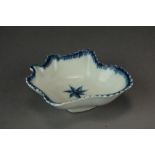 A Caughley pickle leaf dish painted with a Single Flowerhead, circa 1780, unmarked, overall width 7.