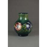 A Moorcroft green ground vase in the 'Anemone' pattern, circa 1953-78,