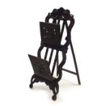 A Chinese carved hardwood folio stand, 19th Century, of A-frame form,