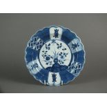 A lobed Caughley plate painted with the Scholar's Rock pattern within powder blue border,