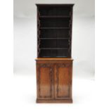 A mid 19th century mahogany cabinet bookcase, of narrow slender form,