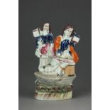 A Staffordshire model of two Royal Children, 19th century, each holding flags on raised base, 15.