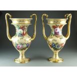 A pair of monumental twin handled Copeland and Garrett vases painted with an assembly of flowers