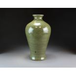 A Chinese Longquan celadon vase, probably Ming Dynasty, of ovoid form with everted rim,