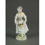 A Chelsea-Derby porcelain figure of a woman with a basket of grapes, circa 1780, 17.