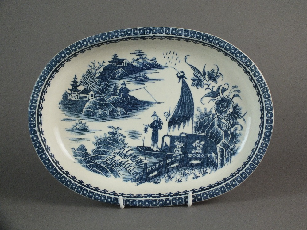 A Caughley oval baking dish transfer-printed with the Pleasure Boat or Fisherman pattern,