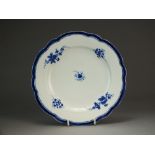 A Caughley plate painted with Sprigs, circa 1785-90, S mark,