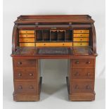 A mid Victorian mahogany barrel top pedestal desk,